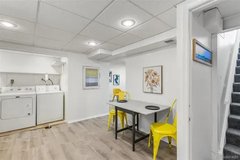 a view of kitchen with furniture and wooden floor