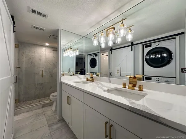 a bathroom with a sink a vanity and a mirror
