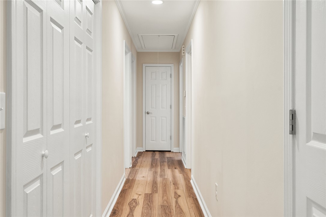 131 Lockaby Road Pelzer, SC 29669 - Photo 22 of 50 This bright hallway connects spaces with classic hardwood floors and clean white trim.