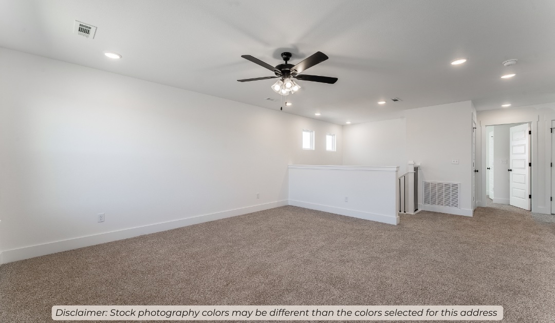 2621 Roe Deer Street Springdale, AR 72762 - Photo 11 of 19 Carpeted loft area featuring a ceiling fan with light fixture, recessed lighting, white balustrade, and trim work