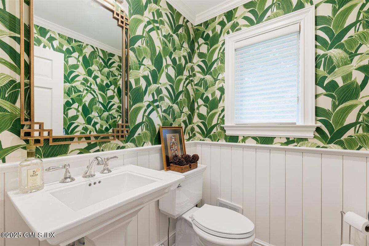 44 Bote Road Greenwich, CT 06830 - Photo 12 of 30 a bathroom with a sink a toilet and a mirror