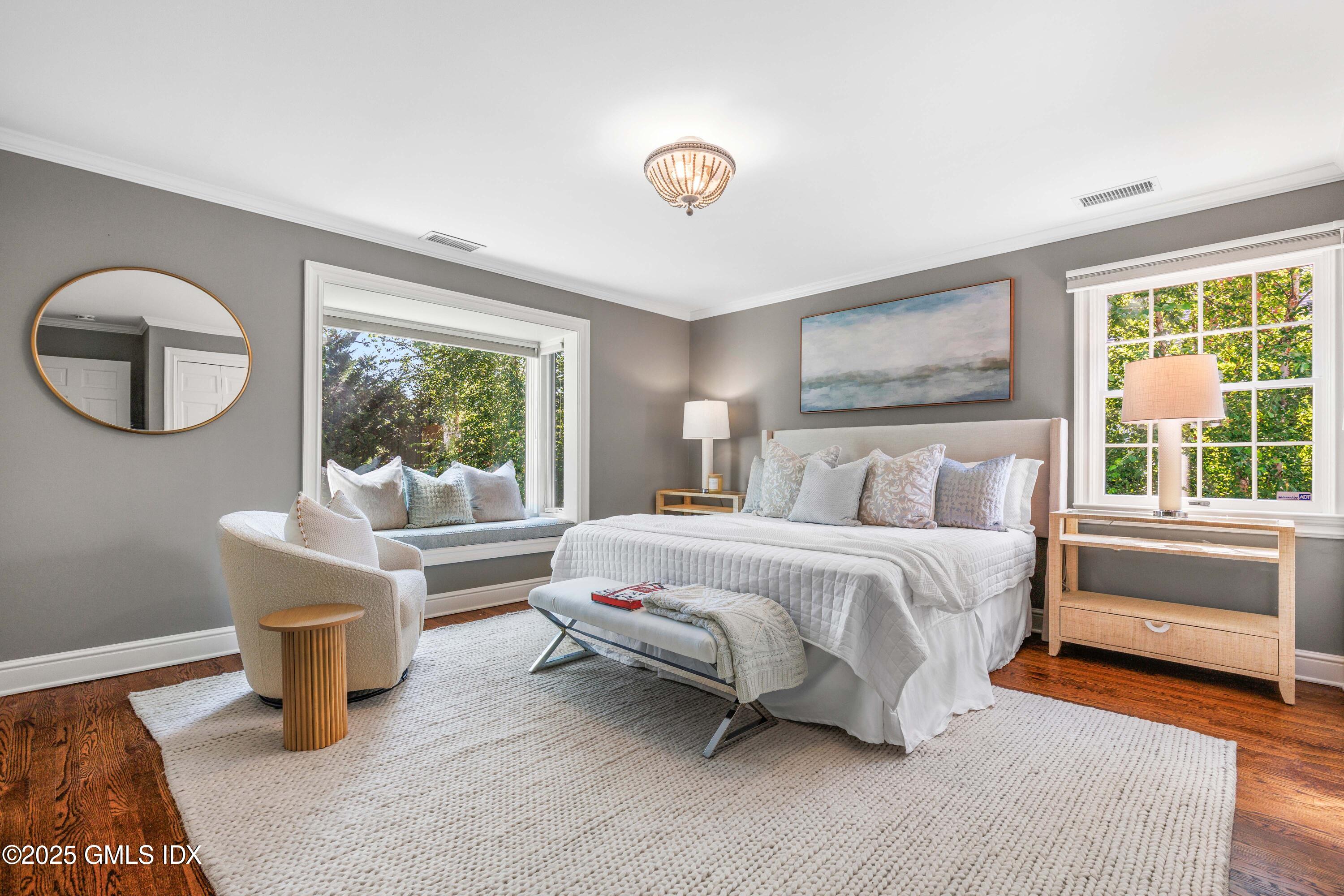 44 Bote Road Greenwich, CT 06830 - Photo 16 of 30 a bedroom with a bed and a large window