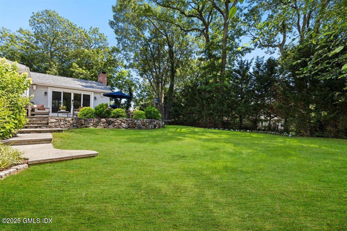 44 Bote Road Greenwich, CT 06830 - Photo 21 of 30 a view of house with front yard