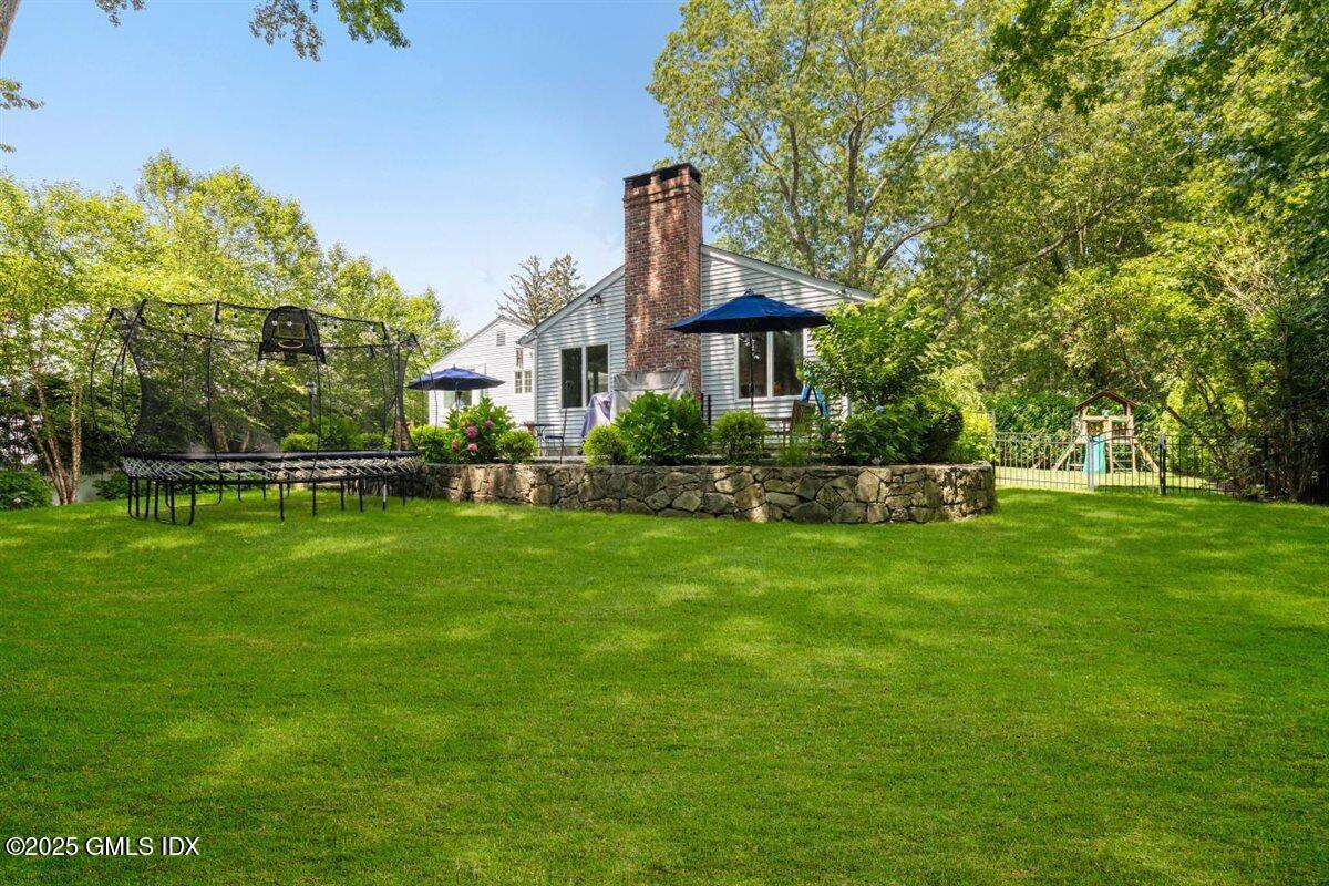 44 Bote Road Greenwich, CT 06830 - Photo 24 of 30 a front view of a house with a garden