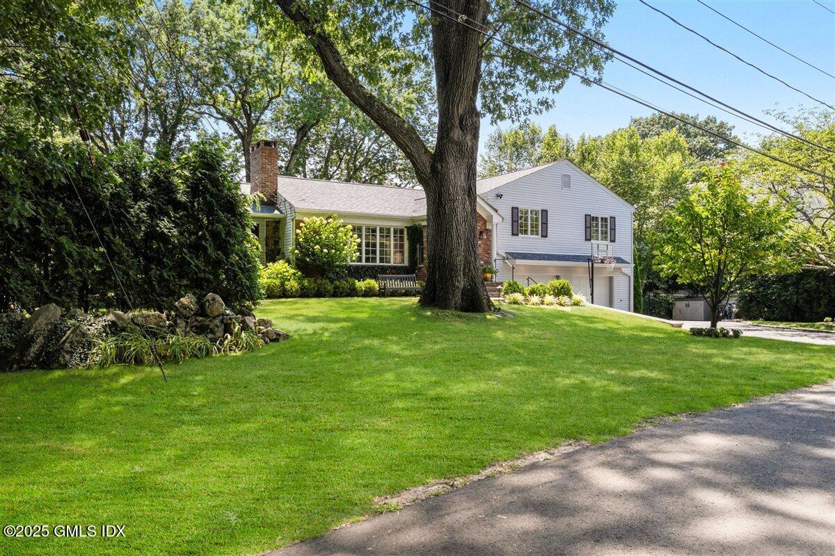 44 Bote Road Greenwich, CT 06830 - Photo 25 of 30 a front view of house with yard and green space