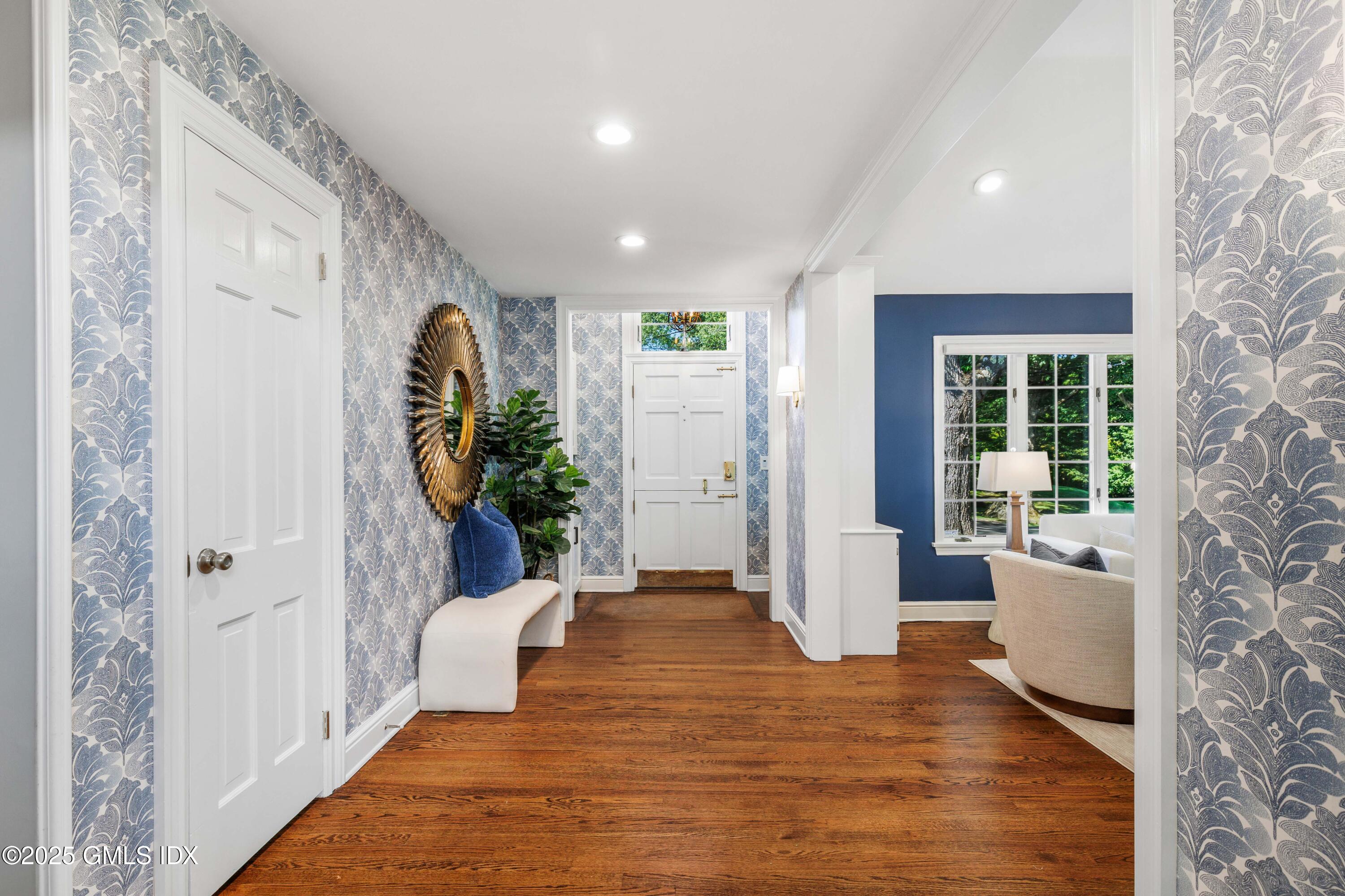 44 Bote Road Greenwich, CT 06830 - Photo 3 of 30 a living room with furniture and a potted plant