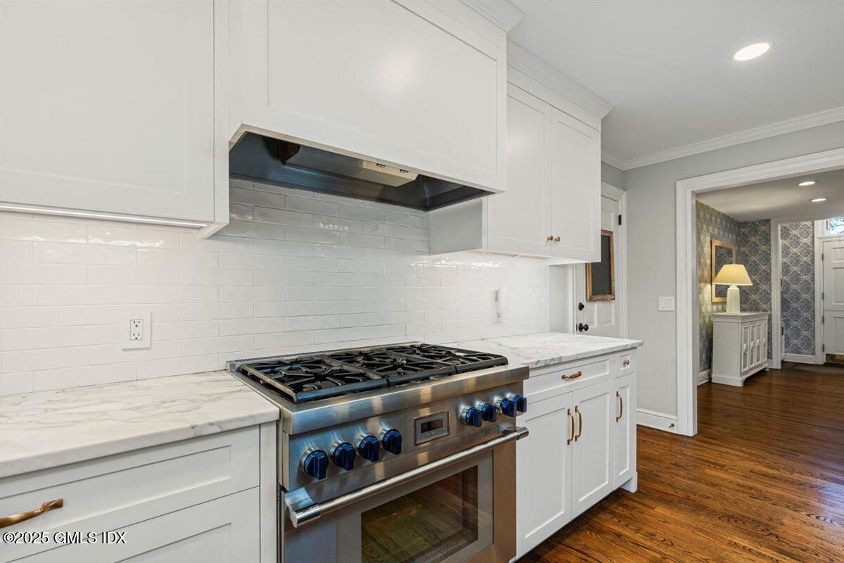 44 Bote Road Greenwich, CT 06830 - Photo 5 of 30 a kitchen with stainless steel appliances a stove and cabinets