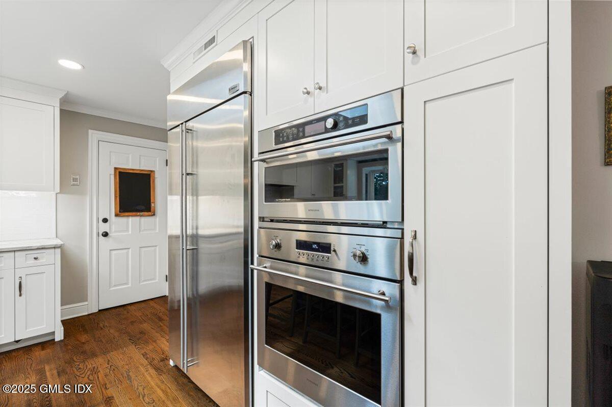 44 Bote Road Greenwich, CT 06830 - Photo 7 of 30 a kitchen with stainless steel appliances a stove a microwave and a refrigerator