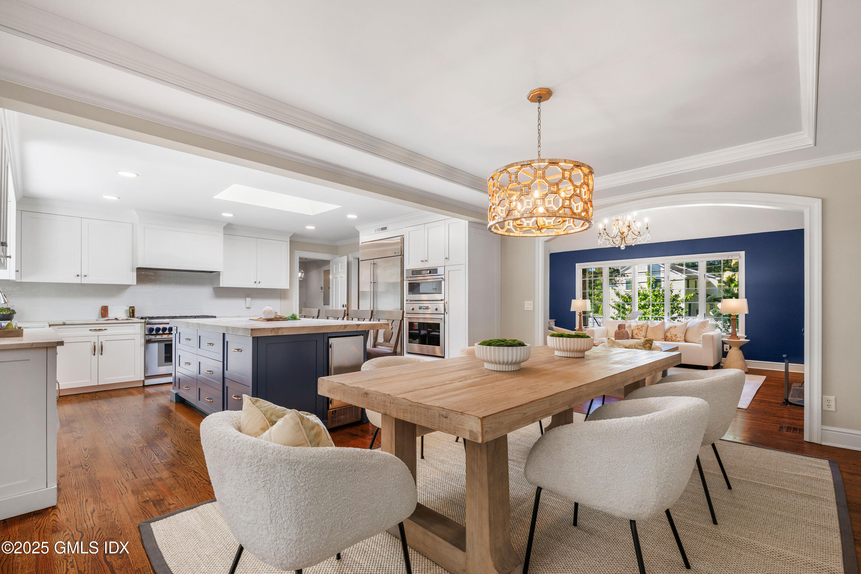 44 Bote Road Greenwich, CT 06830 - Photo 10 of 30 a view of a dining room with furniture a chandelier and wooden floor