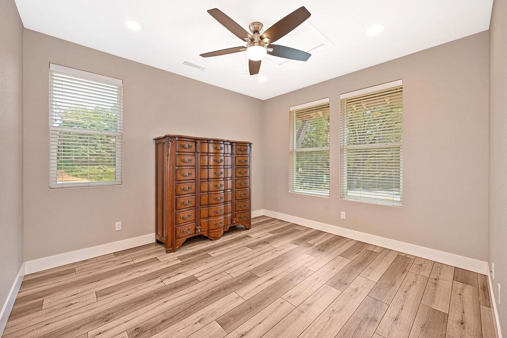 504 Chase Court Colfax, CA 95713 - Photo 27 of 94 a view of an empty room with a window and wooden floor