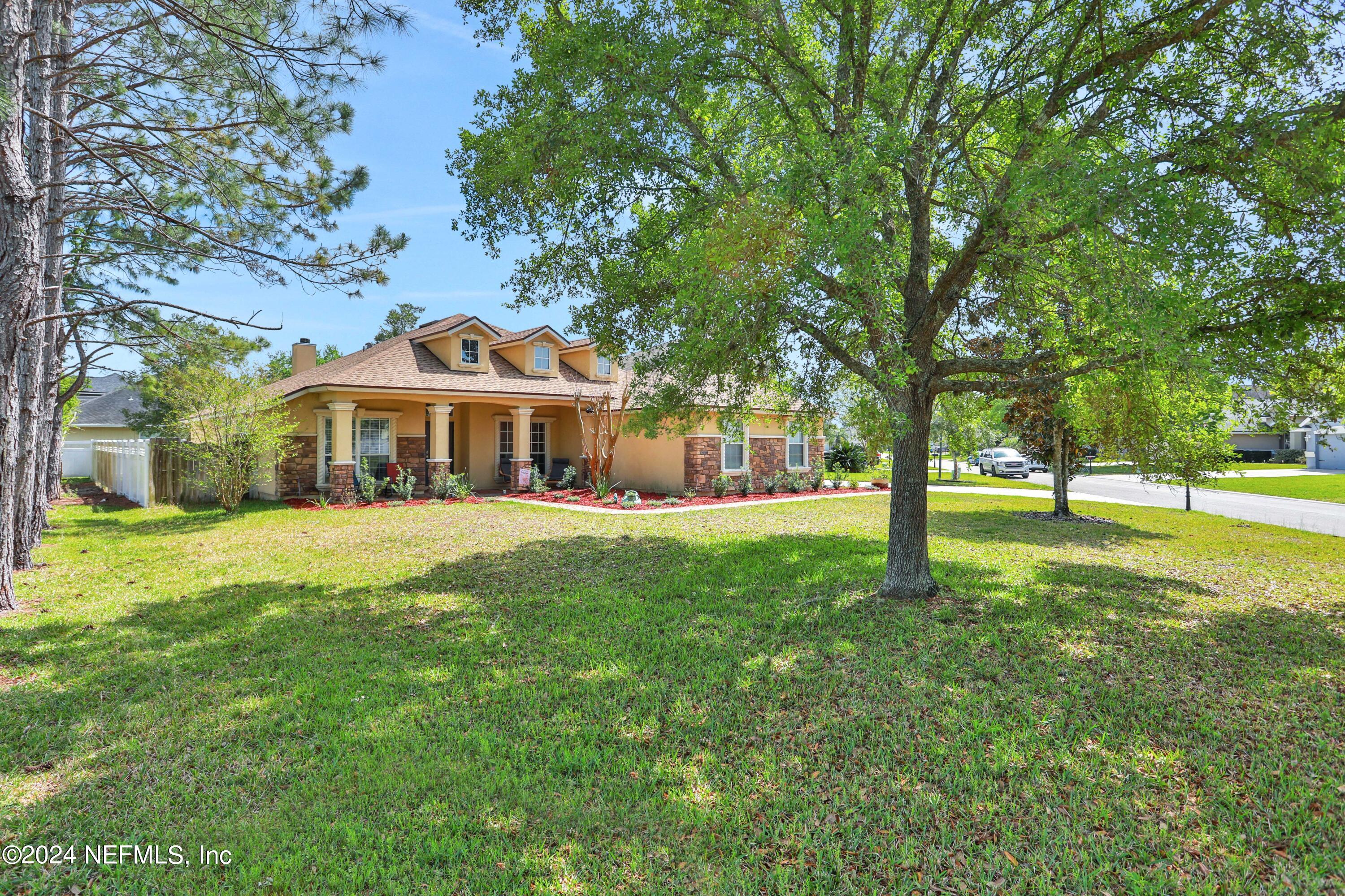 2000 Spring Meadows Court St. Augustine, FL 32092 - Photo 3 of 40 a front view of a house with a yard