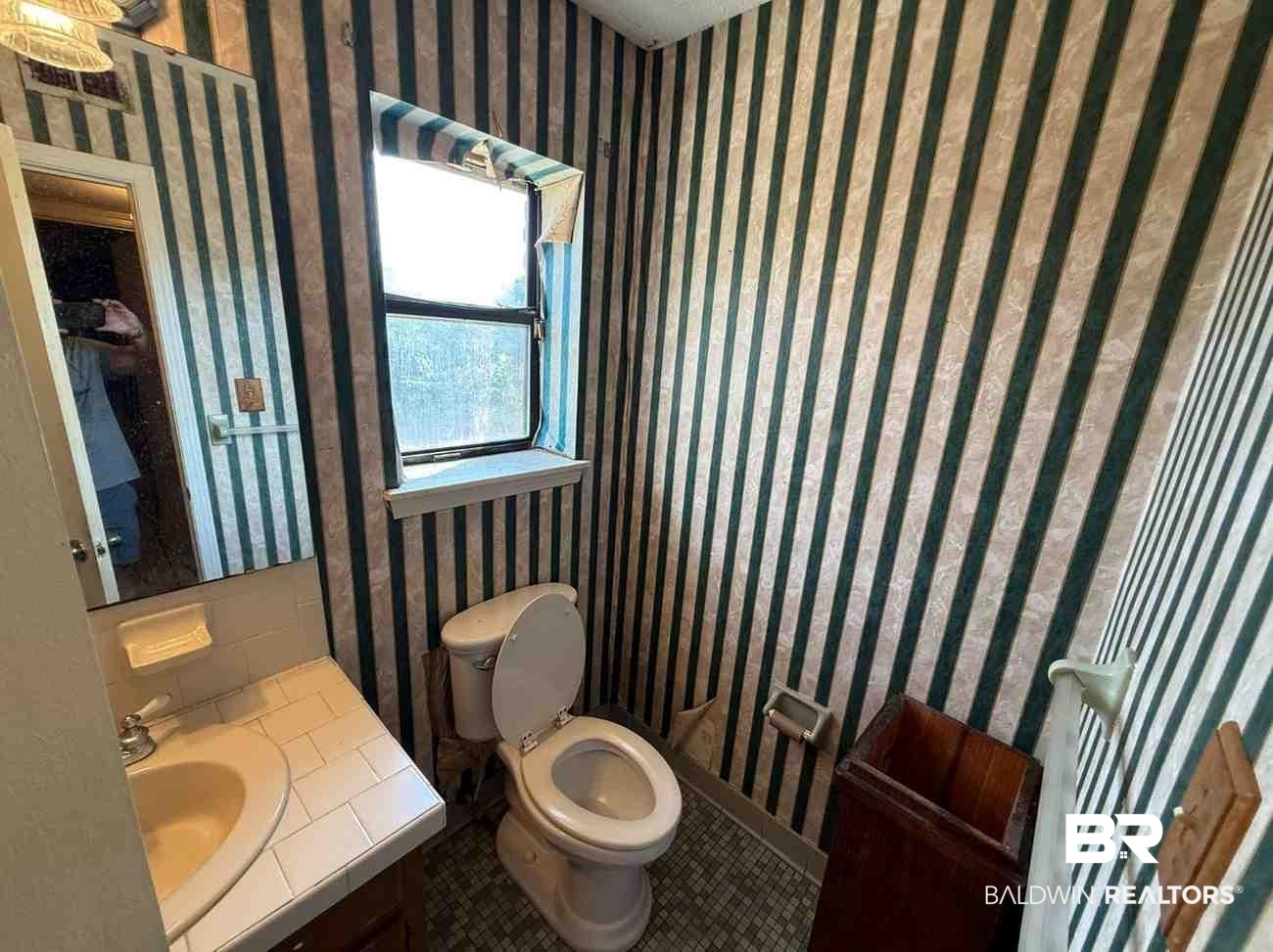 3721 Robertson Court Mobile, AL 36693 - Photo 10 of 22 Half bath with wallpapered walls, vanity, and tile patterned floors