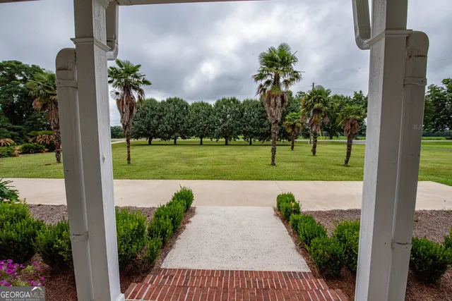 a view of a garage with a bike and white walls