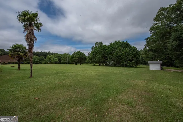 a view of entryway with wooden floor and stairs