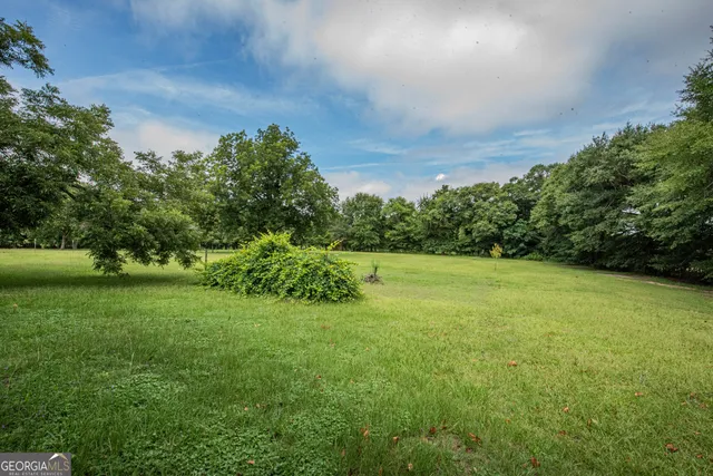 a bathroom with a sink a mirror and vanity