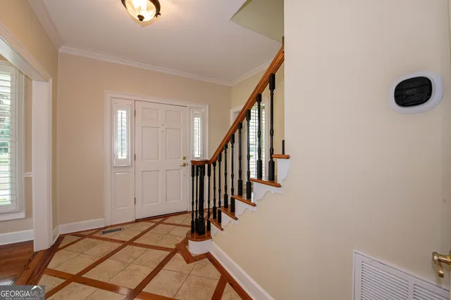 a open kitchen with stainless steel appliances granite countertop a stove top oven a sink dishwasher and a refrigerator with wooden floor