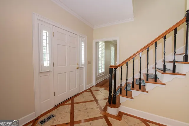 a kitchen with granite countertop a sink stove top oven and cabinets