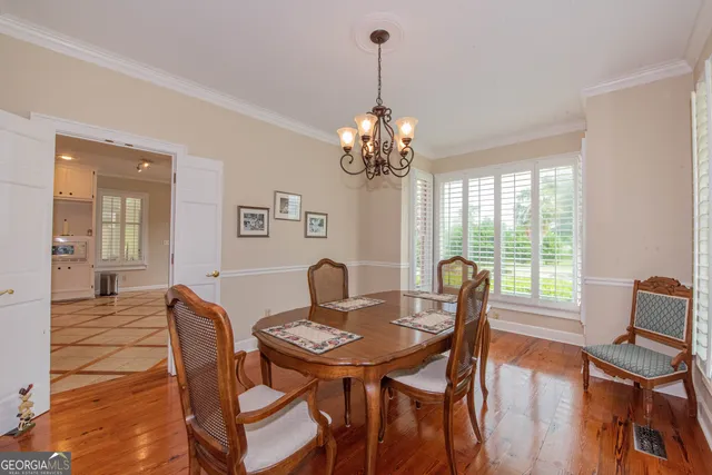a kitchen with a stove a sink and a refrigerator