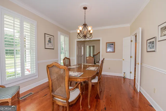 a bedroom with a bed dresser and a window