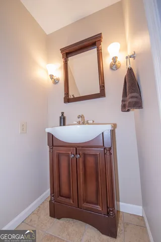 a bathroom with a toilet a sink and a window