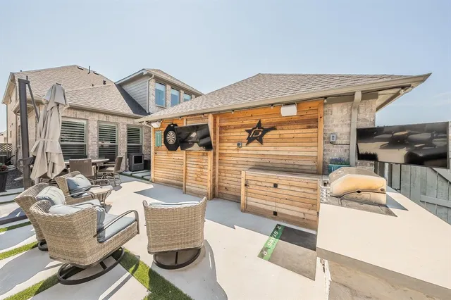 a living room with furniture and a flat screen tv