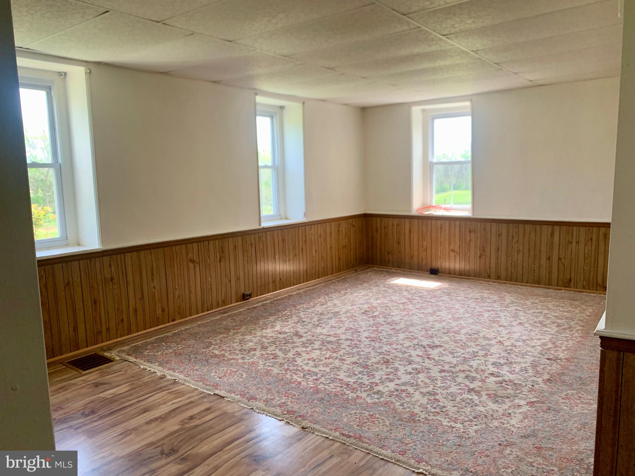 7234 Tommytown Road Sharpsburg, MD 21782 - Photo 11 of 40 a view of an empty room with wooden floor and a window