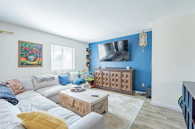 a living room with furniture and a large window