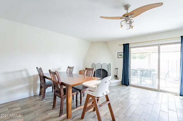 a dining room with furniture and wooden floor