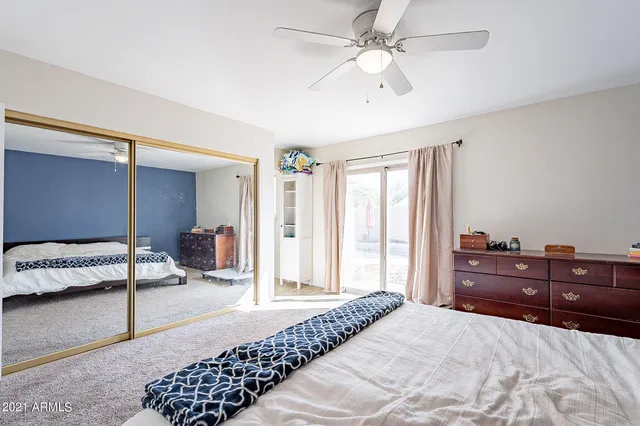 a bedroom with a bed and a closet