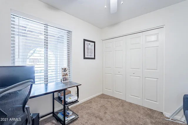 a bathroom with a toilet and shower