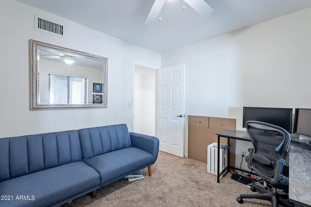 a bathroom with a granite countertop sink and mirror