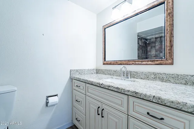 a view of a patio with table and chairs potted plants with wooden floor