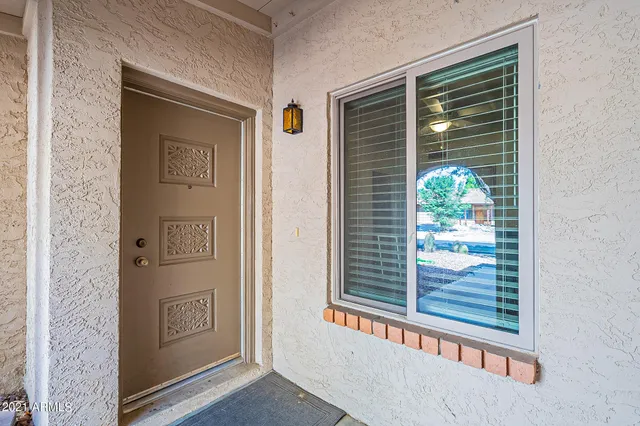 a view of a door and a window
