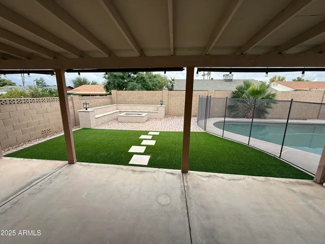 a view of a backyard of the house