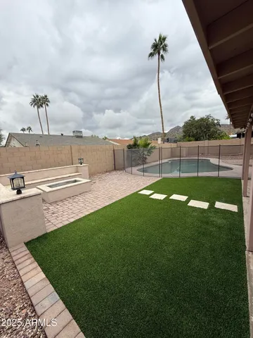 a view of a golf course with a lake