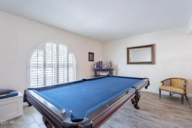a room with projector and furniture