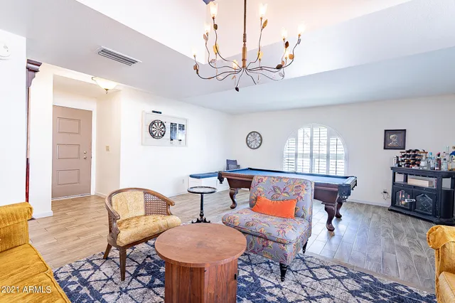 a living room with furniture and a window