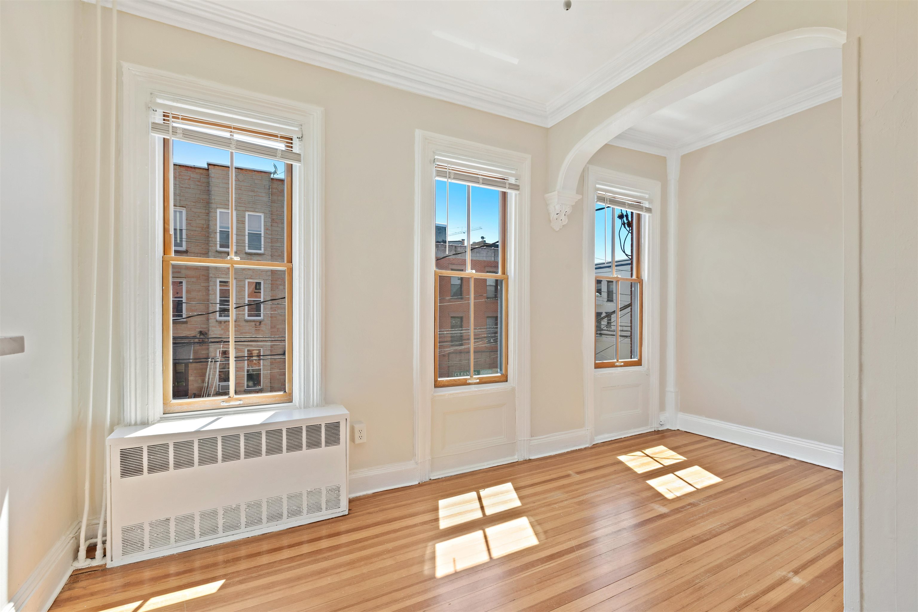 804 Bloomfield Street, Unit 2 Hoboken, NJ 07030 - Photo 2 of 14 a view of a room with wooden floor and windows