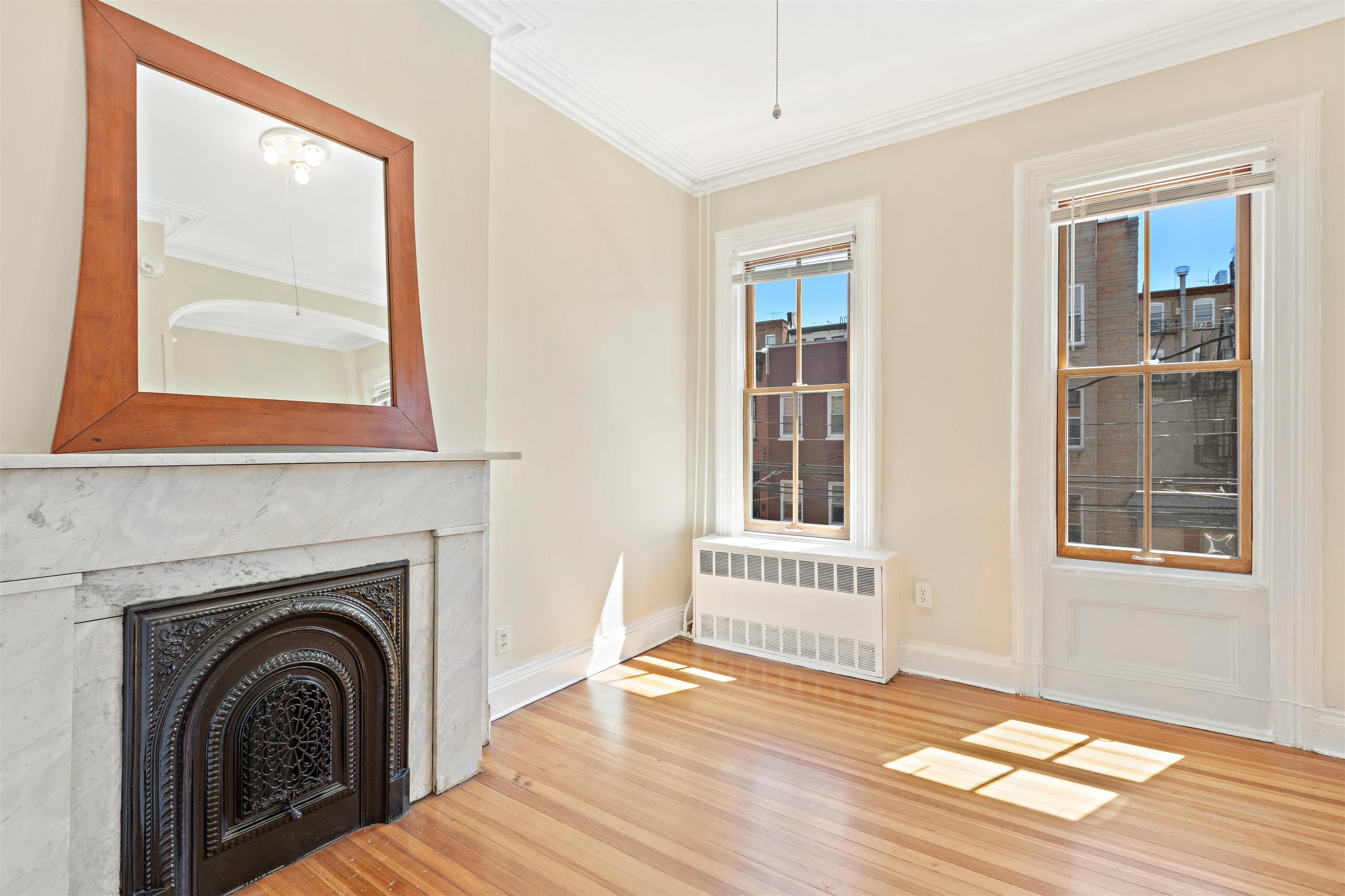 804 Bloomfield Street, Unit 2 Hoboken, NJ 07030 - Photo 3 of 14 a view of a livingroom with a fireplace