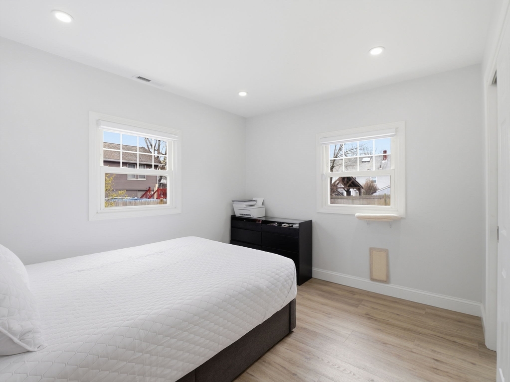 63 Jasper Street Saugus, MA 01906 - Photo 18 of 39 a bedroom with a large bed and a window