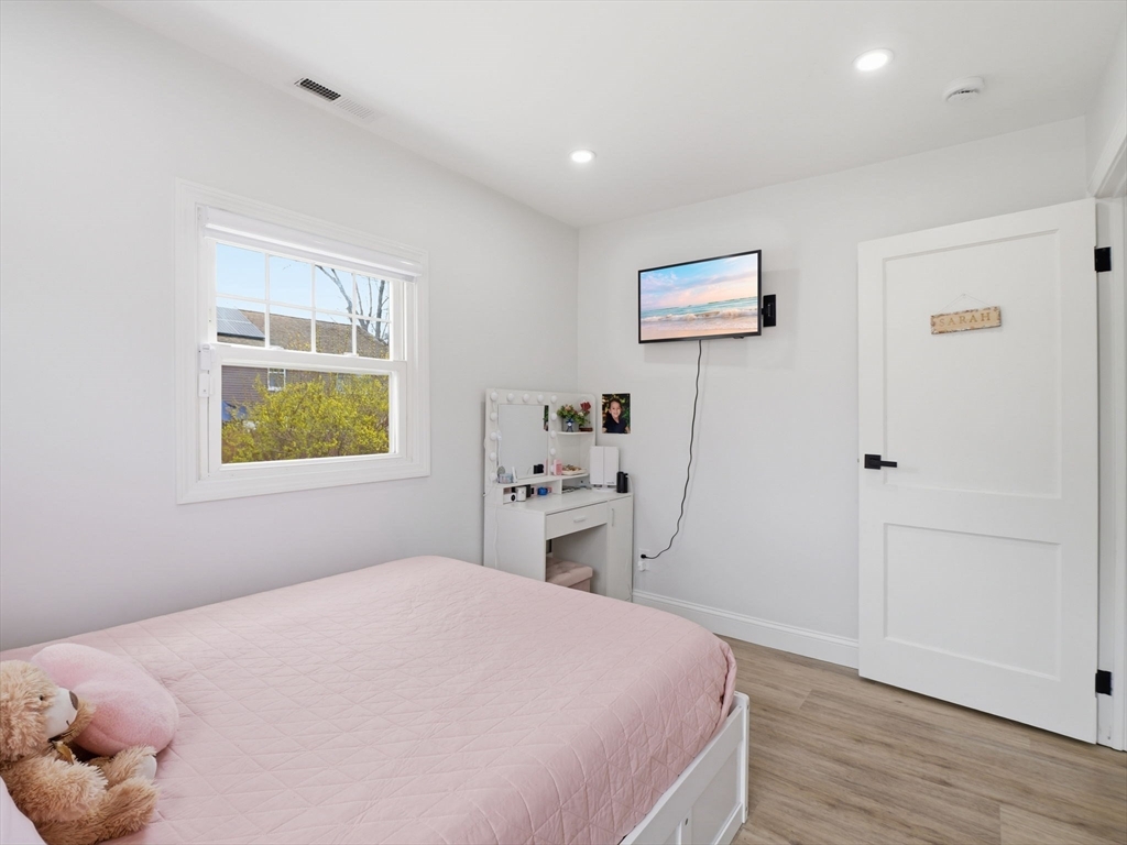 63 Jasper Street Saugus, MA 01906 - Photo 21 of 39 a bedroom with a bed and a window