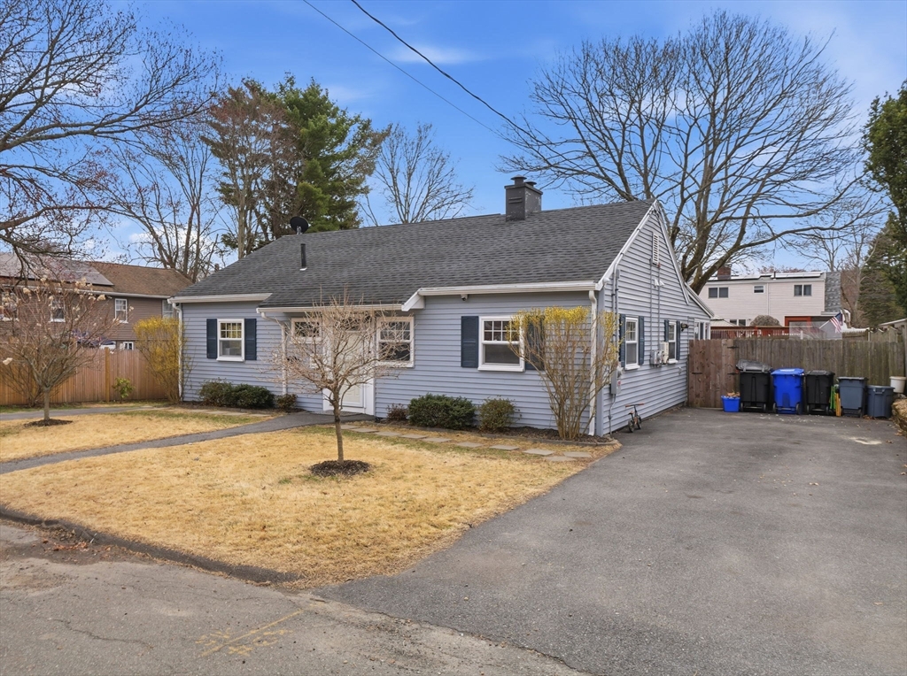 63 Jasper Street Saugus, MA 01906 - Photo 32 of 39 a house with palm tree in front of it
