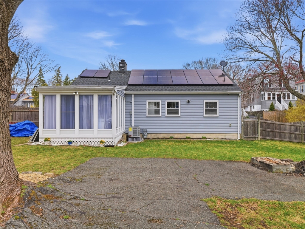 63 Jasper Street Saugus, MA 01906 - Photo 34 of 39 a front view of a house with a yard and garage