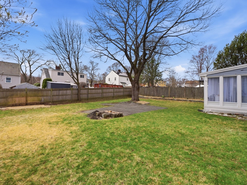 63 Jasper Street Saugus, MA 01906 - Photo 37 of 39 a view of a yard with a large tree