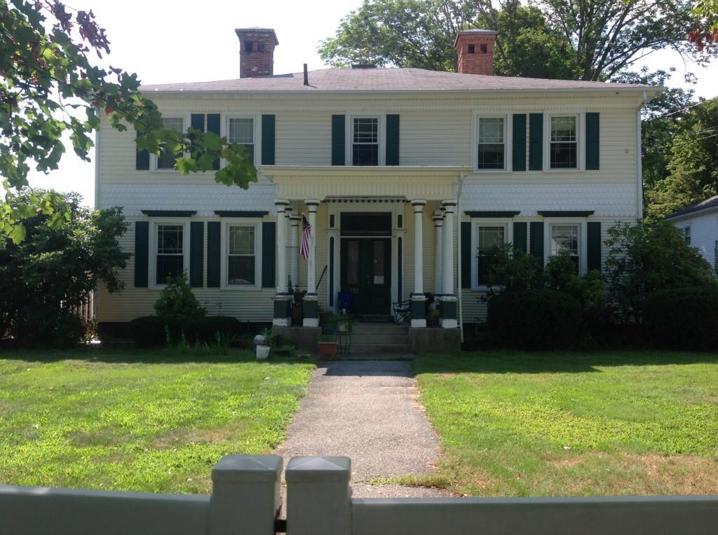170 Washington Street Norwich, CT 06360 - Photo 1 of 1 a front view of a house with garden and yard