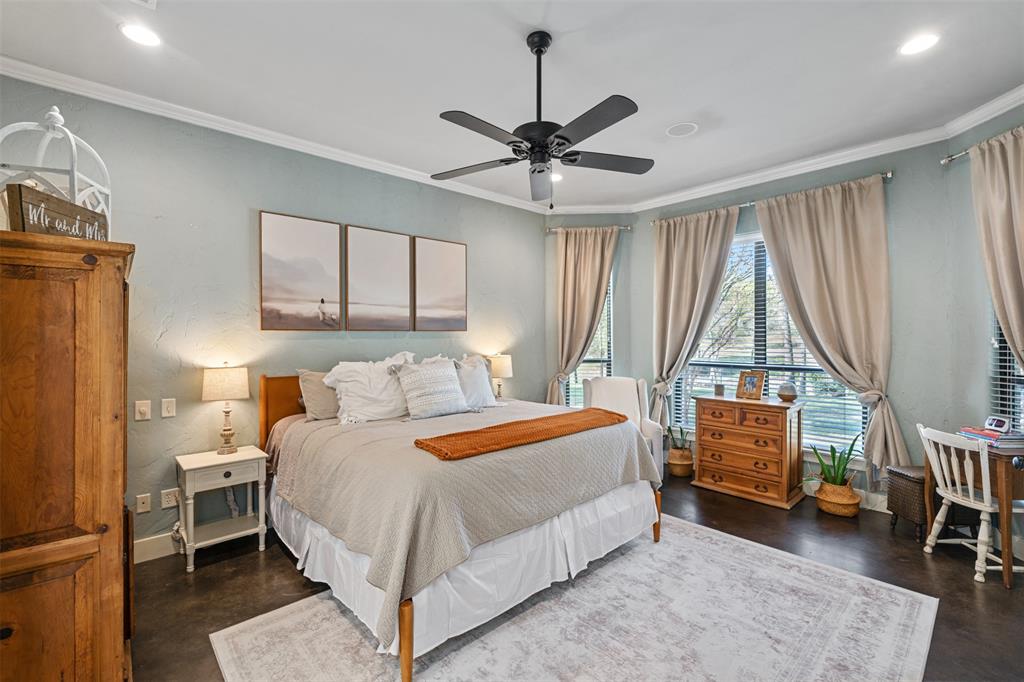 107 Nautical Point Mabank, TX 75143 - Photo 16 of 36 a bedroom with a bed and a chandelier