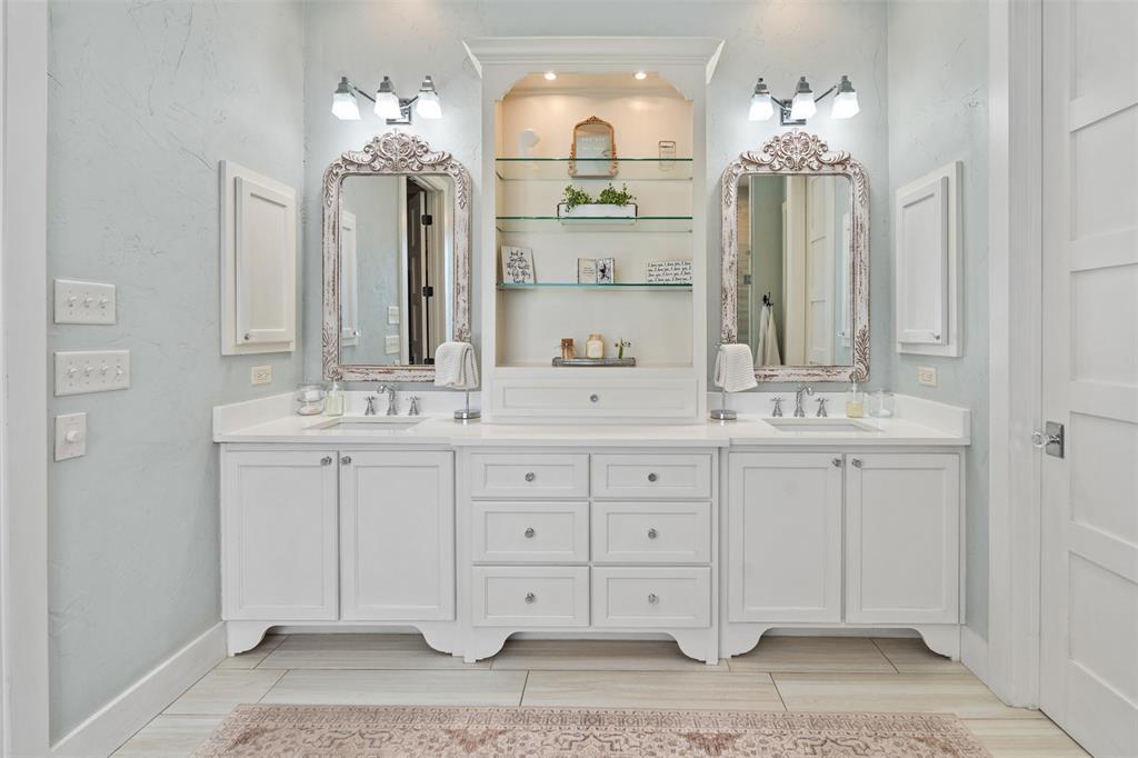107 Nautical Point Mabank, TX 75143 - Photo 18 of 36 a bathroom with double sink and a mirror