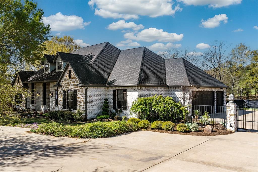 107 Nautical Point Mabank, TX 75143 - Photo 2 of 36 a front view of a house with plants