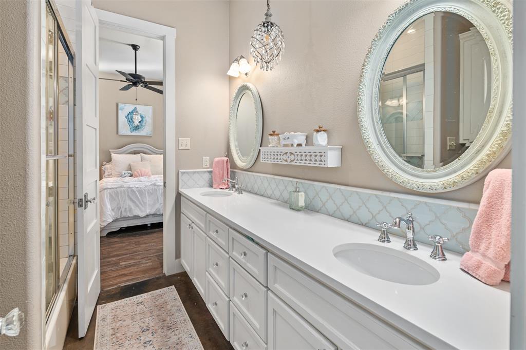 107 Nautical Point Mabank, TX 75143 - Photo 23 of 36 a en suite bathroom with a double vanity sink and a mirror