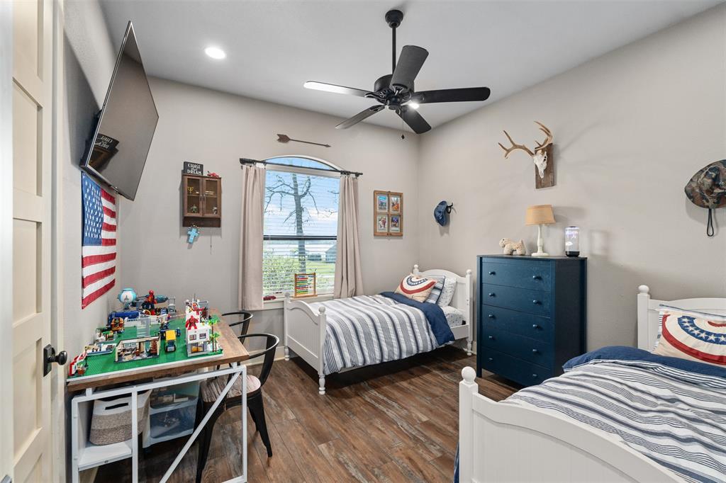 107 Nautical Point Mabank, TX 75143 - Photo 25 of 36 a bedroom with a bed and a window